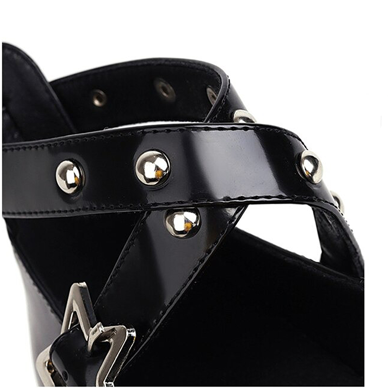 Close-up of black Gothic platform sandals featuring silver rivets and star detail, perfect for autumn fashion.