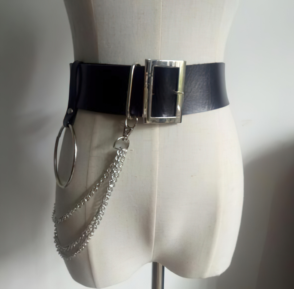 Gothic women's black faux leather belt with metal chains and rings, perfect for punk style outfits at parties or concerts.