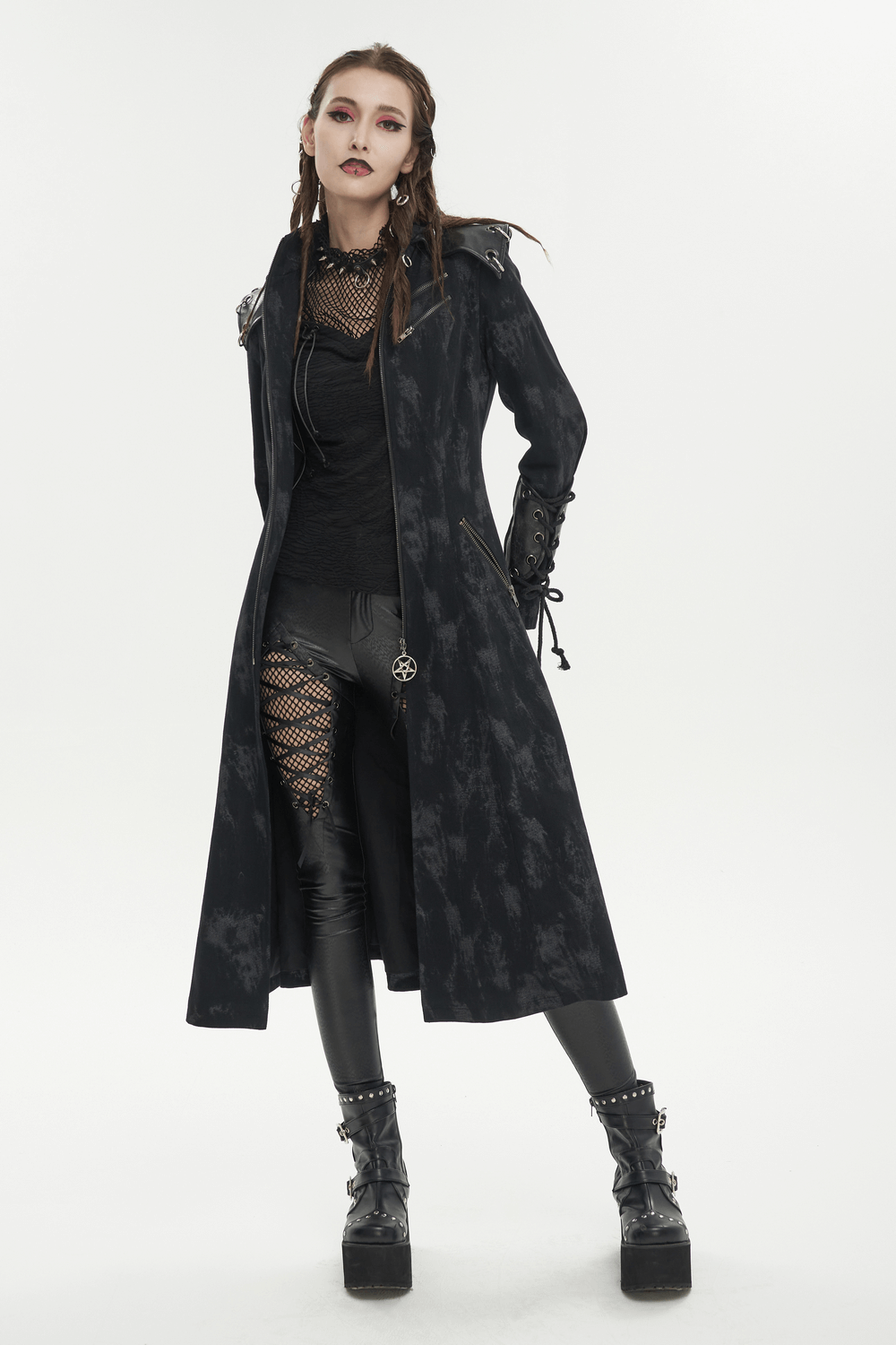 Gothic women's hooded coat in a stylish dark ensemble, embodying edgy fashion and modern sophistication.
