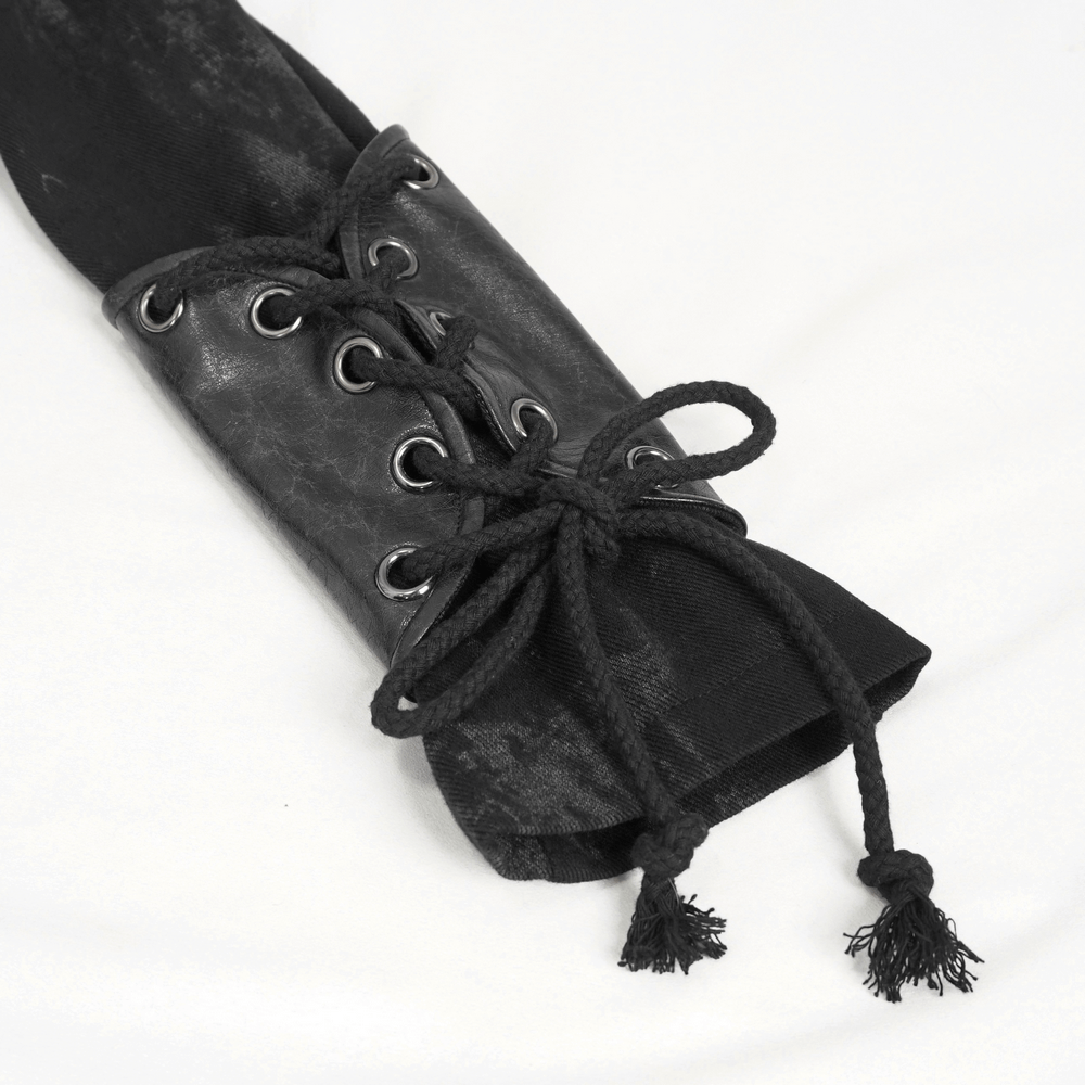 Close-up of a gothic women's hooded coat sleeve with lace-up details and black fabric, showcasing dark fashion style.