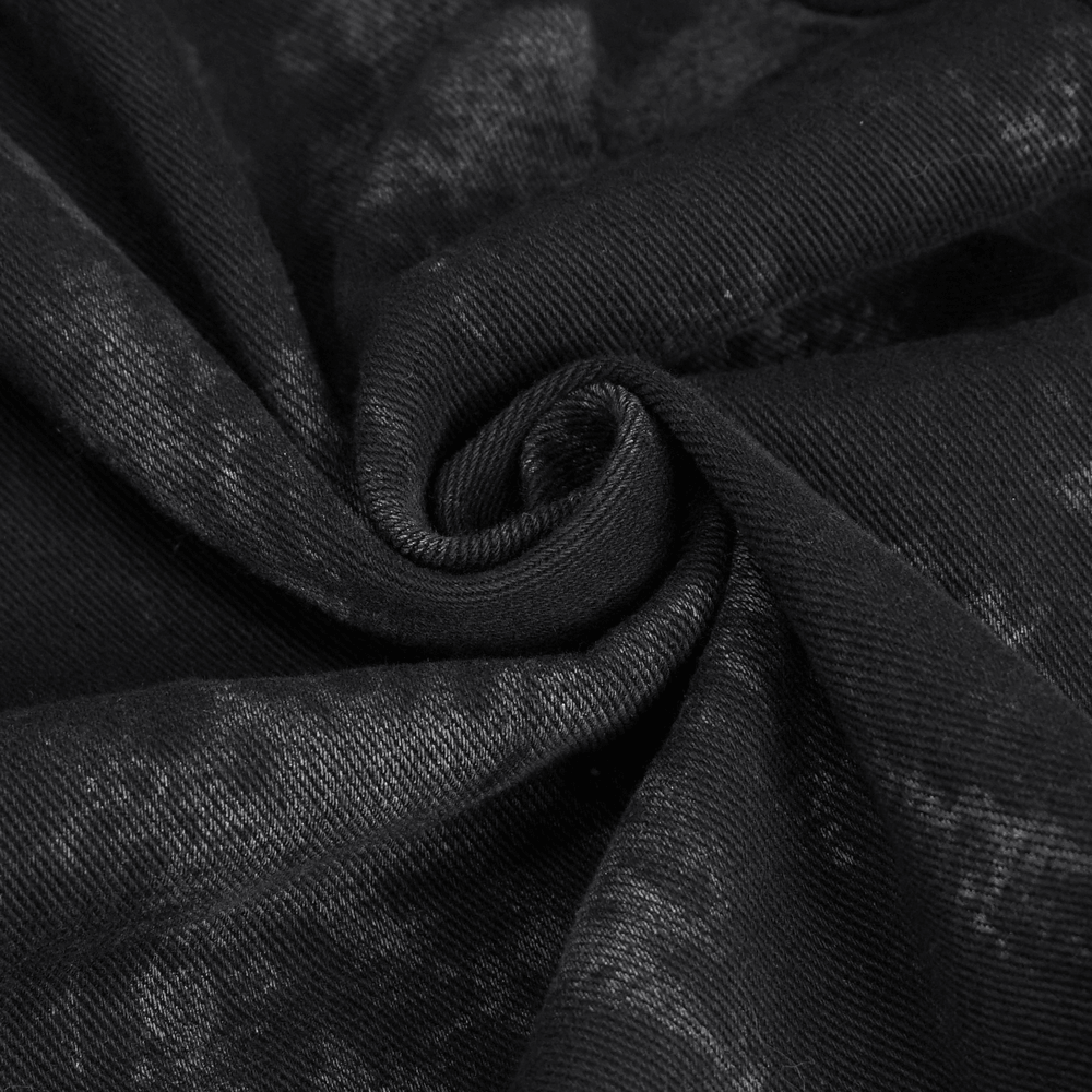 Close-up of soft black fabric showcasing a unique texture, perfect for a gothic hooded coat.