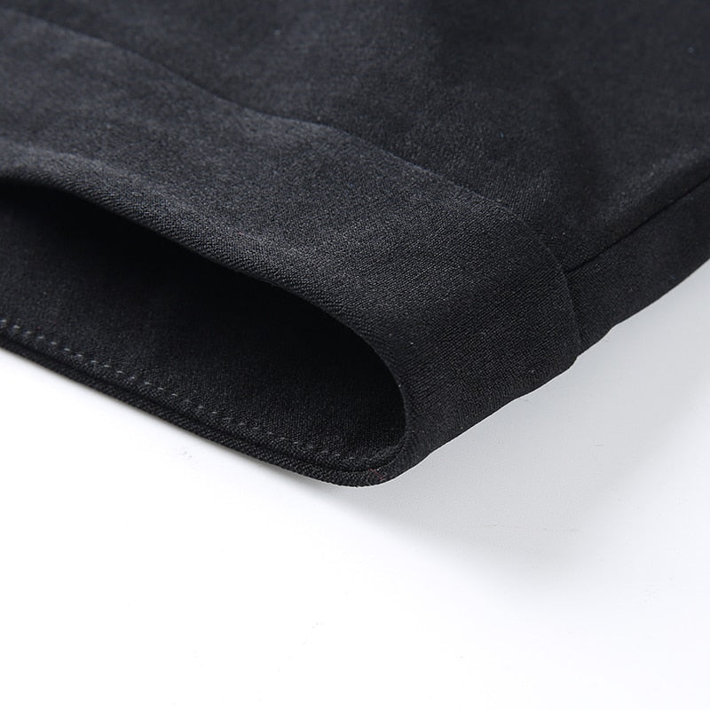 Close-up of Gothic women's pencil pants showcasing the sleek black fabric and designed cuff for a stylish look.