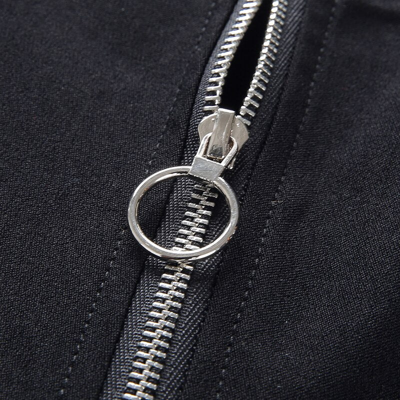 Close-up of black zipper hardware showcasing a silver zip pull for Gothic women's pencil pants.
