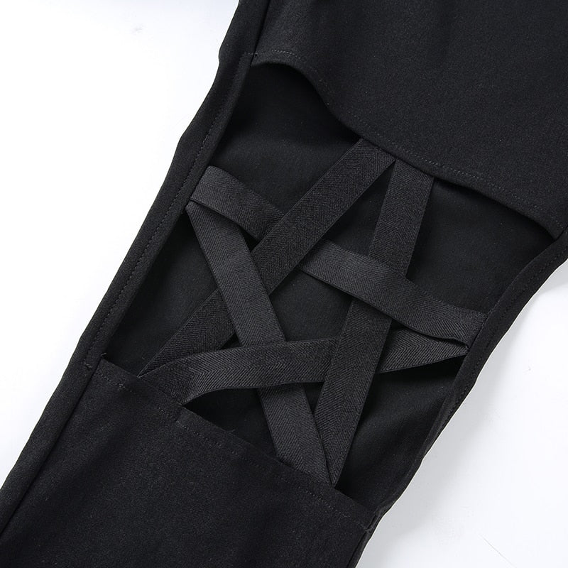 Close-up of hollow hole design on Gothic women's pencil pants featuring pentagram inserts.