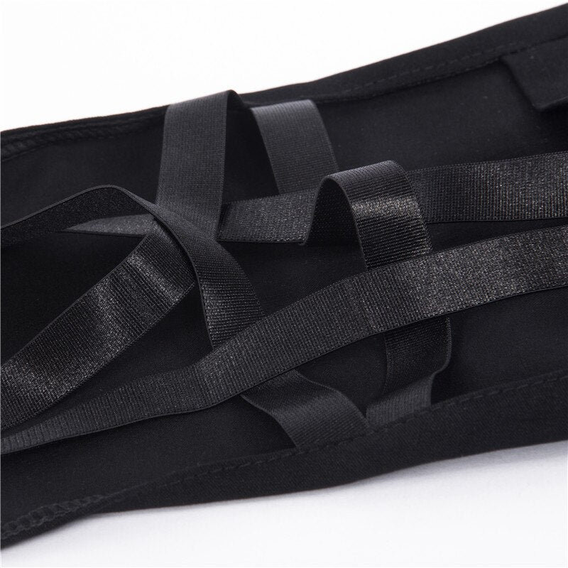 Close-up of black fabric straps on Gothic women's pencil pants, showcasing sleek design and intricate detailing.