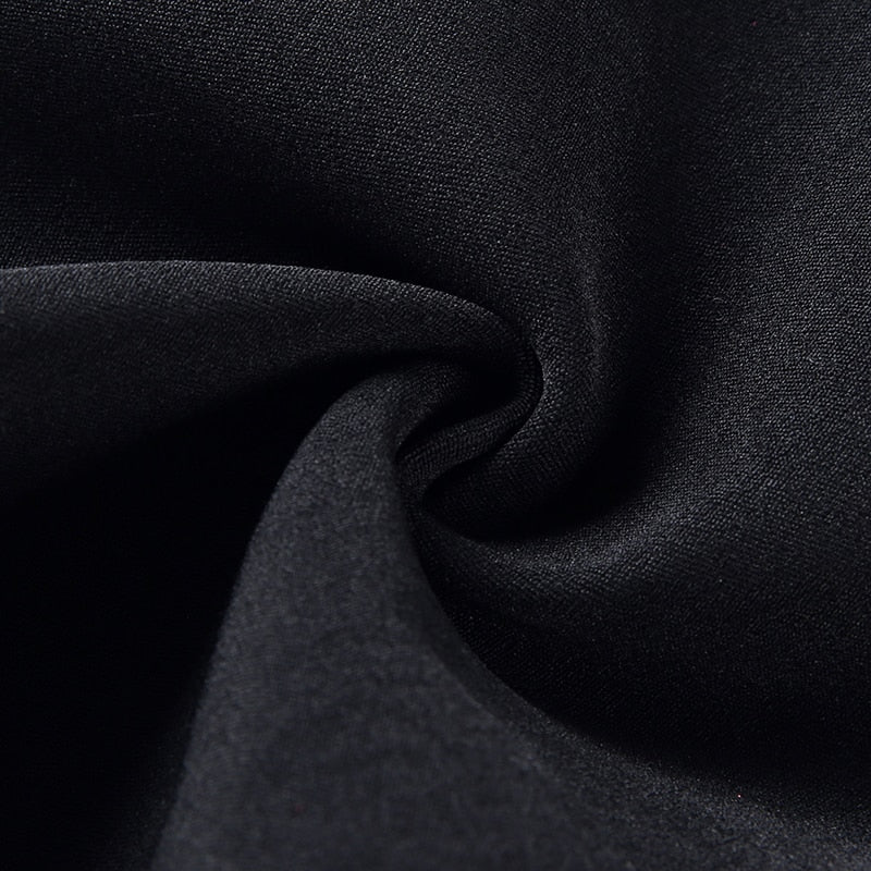Close-up of soft black fabric, ideal for Gothic women's pencil pants featuring stretch bandage design.