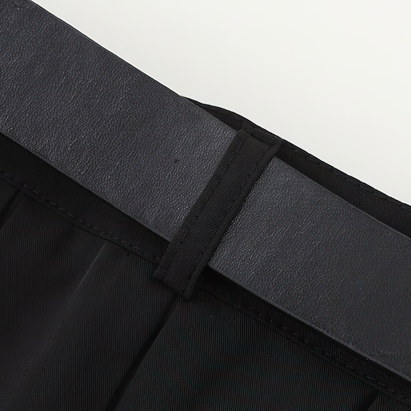 Close-up of the black belt on a Gothic women's pleated mini skirt, showcasing its stylish design and detail.