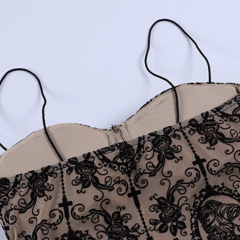 Gothic women's backless top in beige with black floral and cross print, showcasing elegant straps and deep neckline.