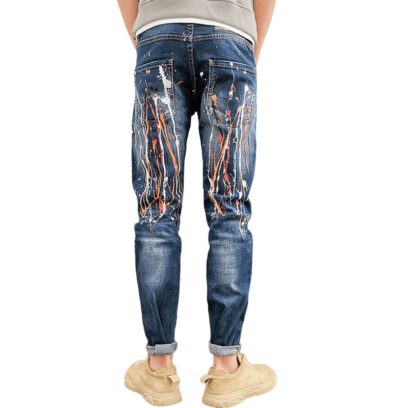 Back view of men's skinny graffiti ripped jeans, showcasing trendy design and alternative style.