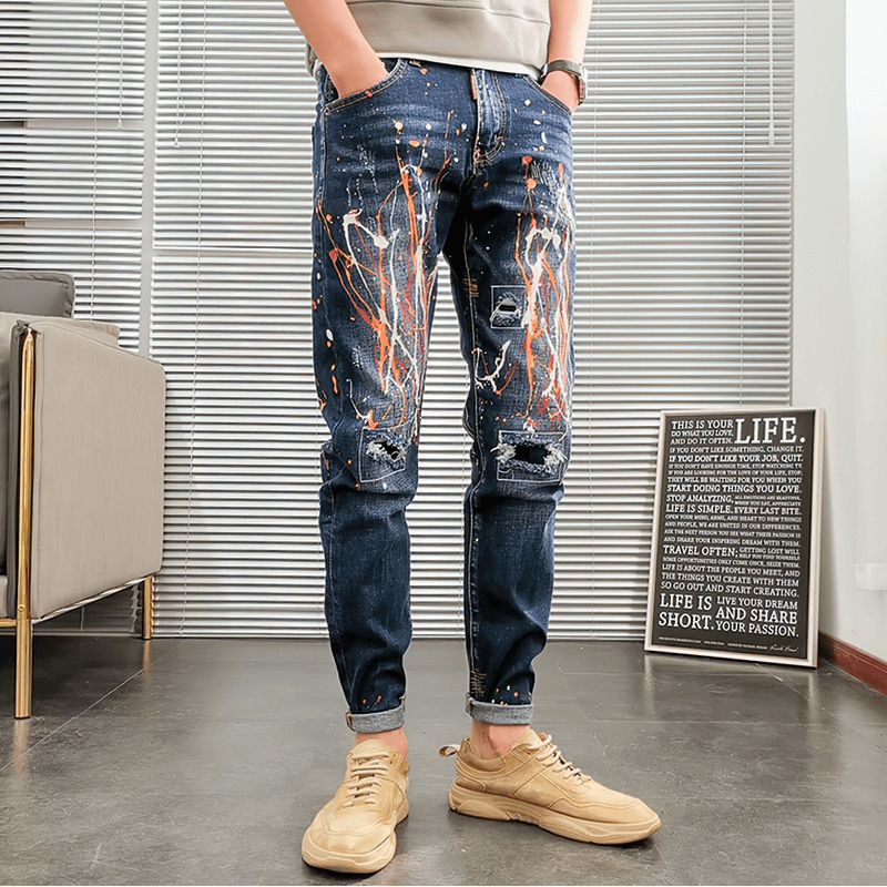 Men's graffiti ripped skinny jeans with a trendy design, perfect for an alternative wardrobe.