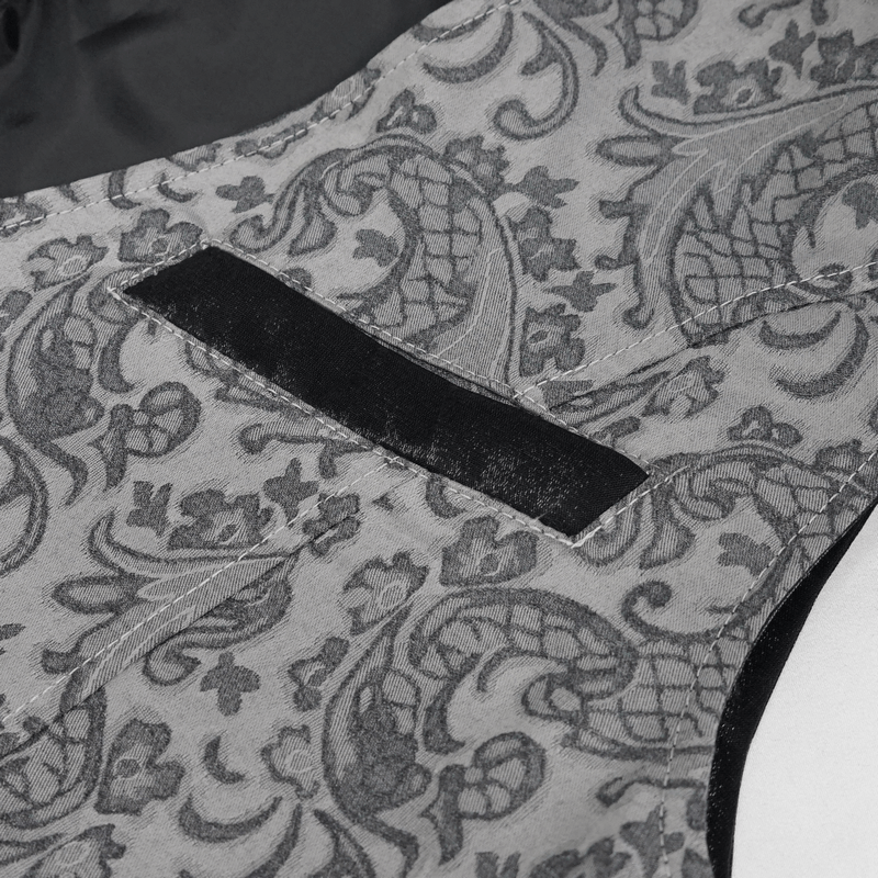 Close-up of gray and black gothic jacquard fabric on a men's waistcoat, showcasing elegant retro detailing.