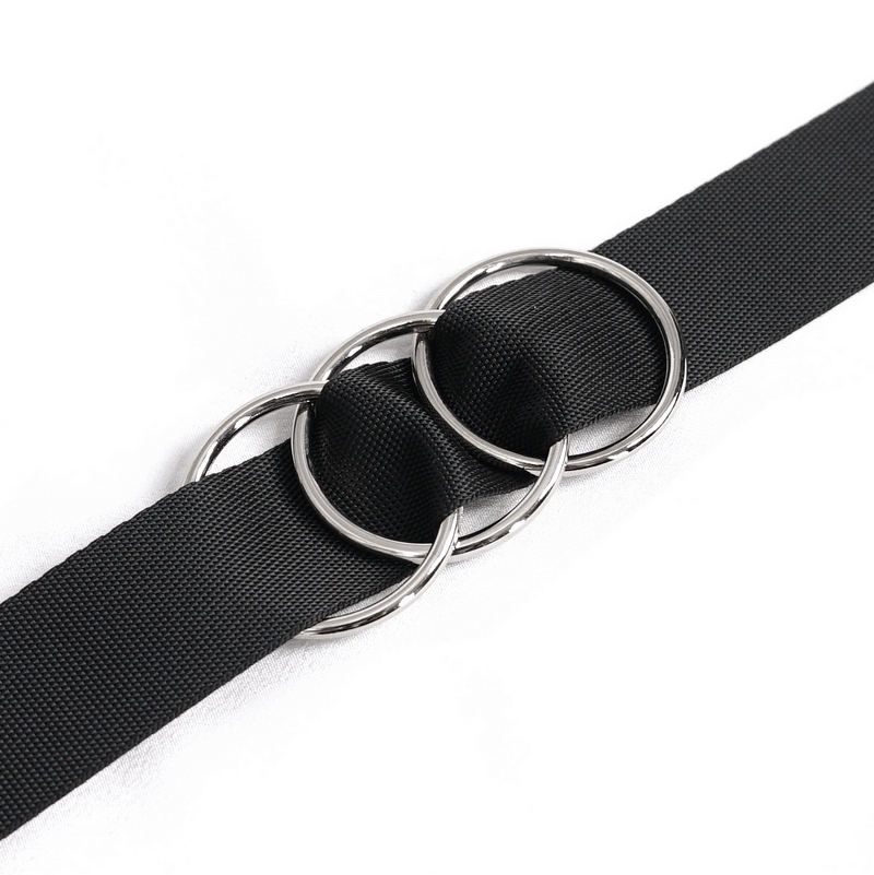 Black belt with interlocking silver rings, stylish accessory for grunge outfits.