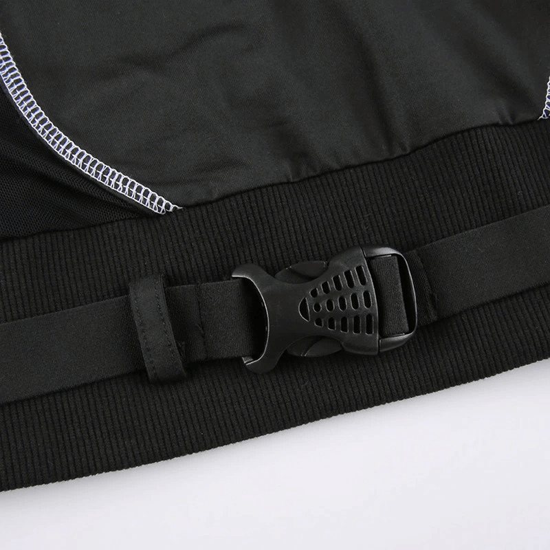 Close-up of the adjustable buckle strap on a women's black patchwork top for a stylish fit.