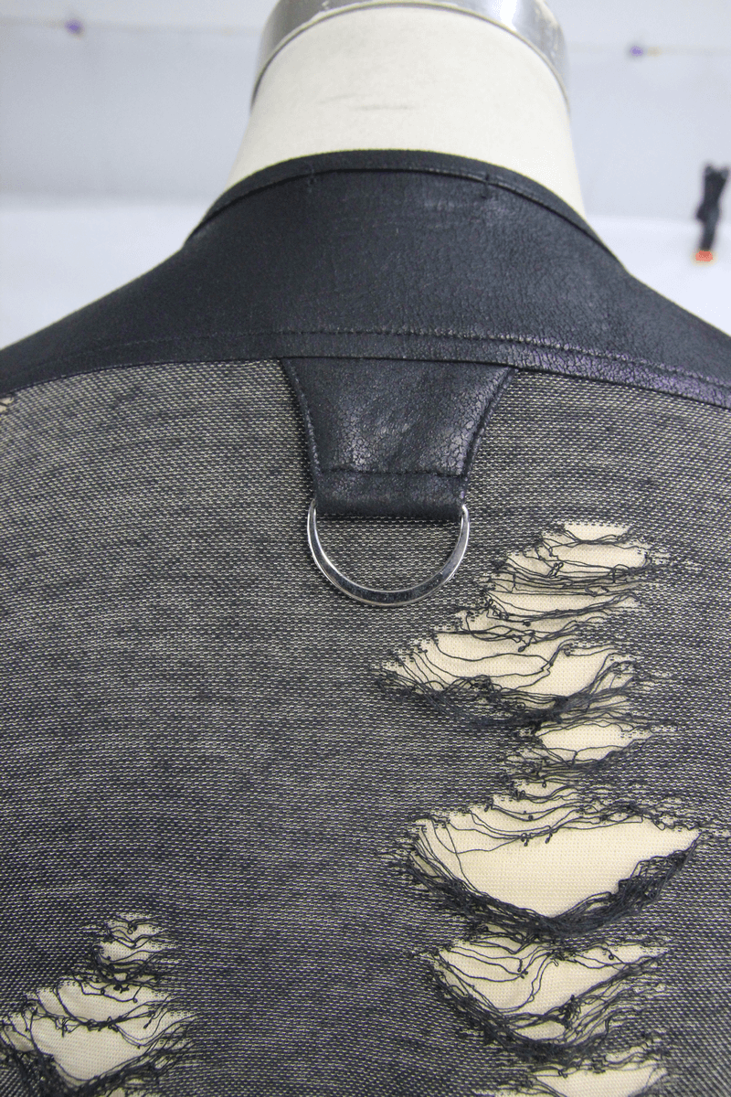 Back view of a men's distressed tank top featuring irregular rips and a crisscross lacing detail.