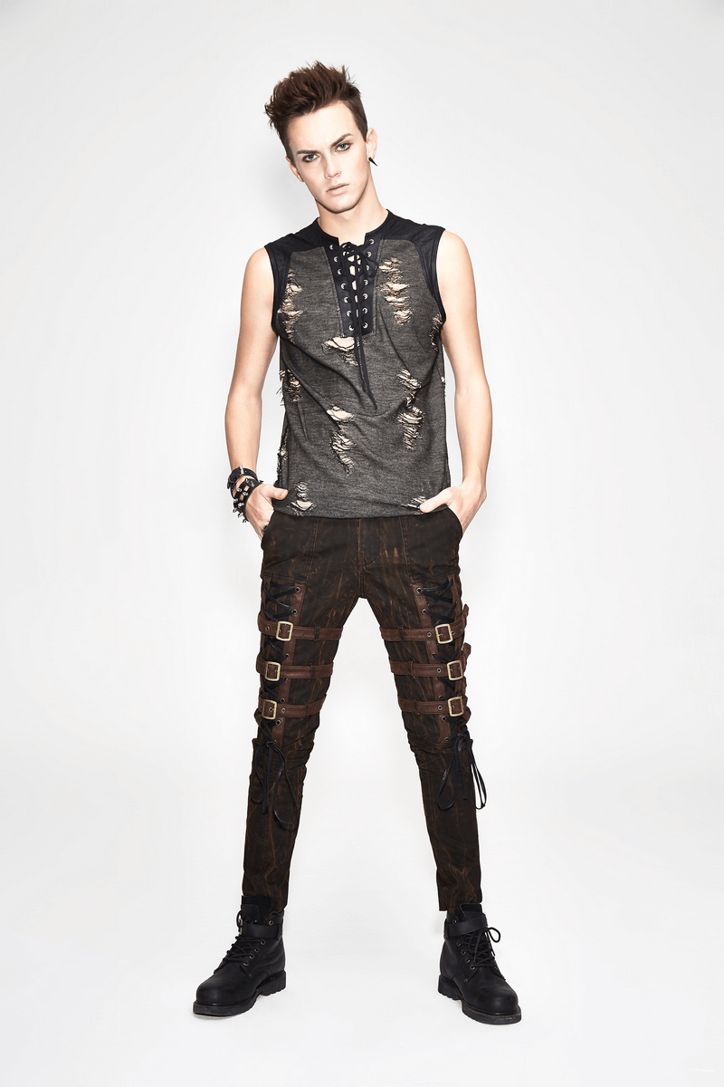 Men's grunge tank top with crisscross lacing and distressed style, paired with stylish pants for an edgy look.