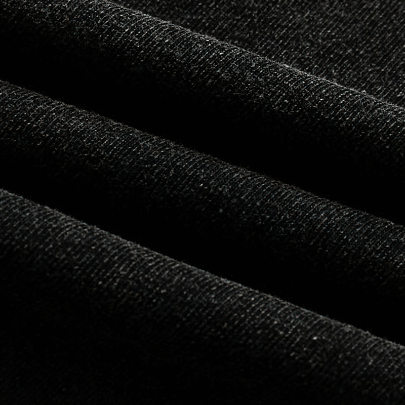 Close-up of black cotton fabric texture suitable for grunge style tank tops.