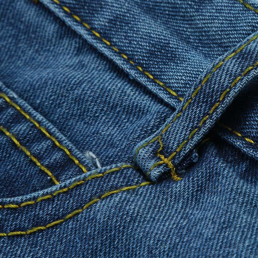 Close-up of blue denim fabric showcasing stitching details of a grunge style high waist mini skirt.