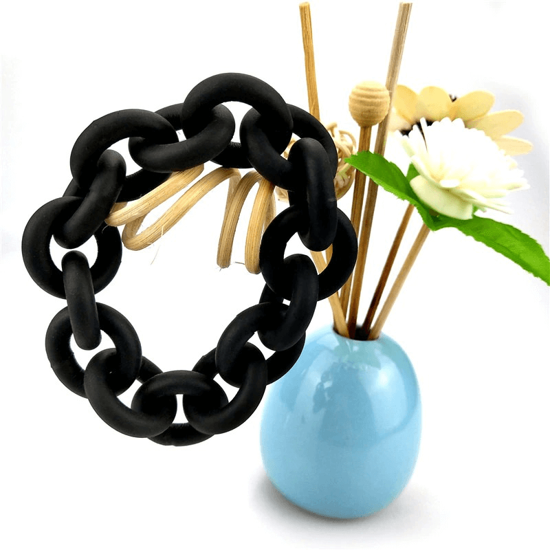 Handmade black rubber bangle for women, perfect punk accessory for trendy outfits, stylish and eye-catching design.