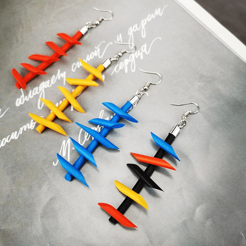 Handmade rubber long earrings in vibrant colors; gothic silicone jewelry for women, stylish and eye-catching accessory.