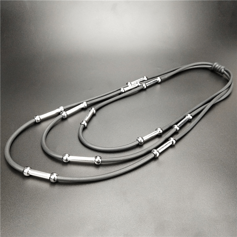 Handmade black rubber necklace with silver accents, perfect Bohemian accessory for casual outfits.