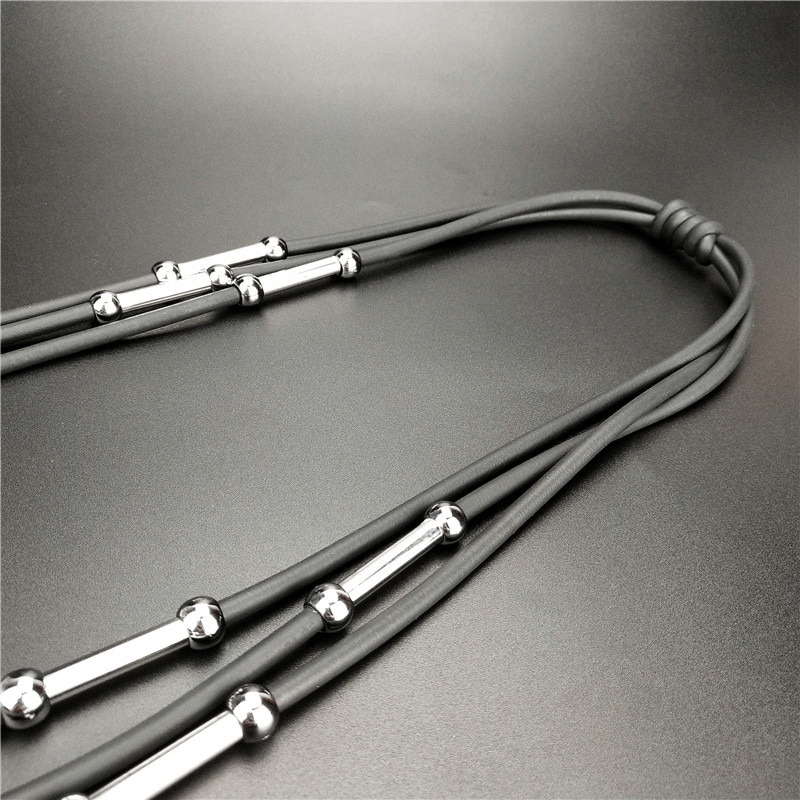 Handmade black rubber necklace with stylish pendants, perfect for casual bohemian outfits.