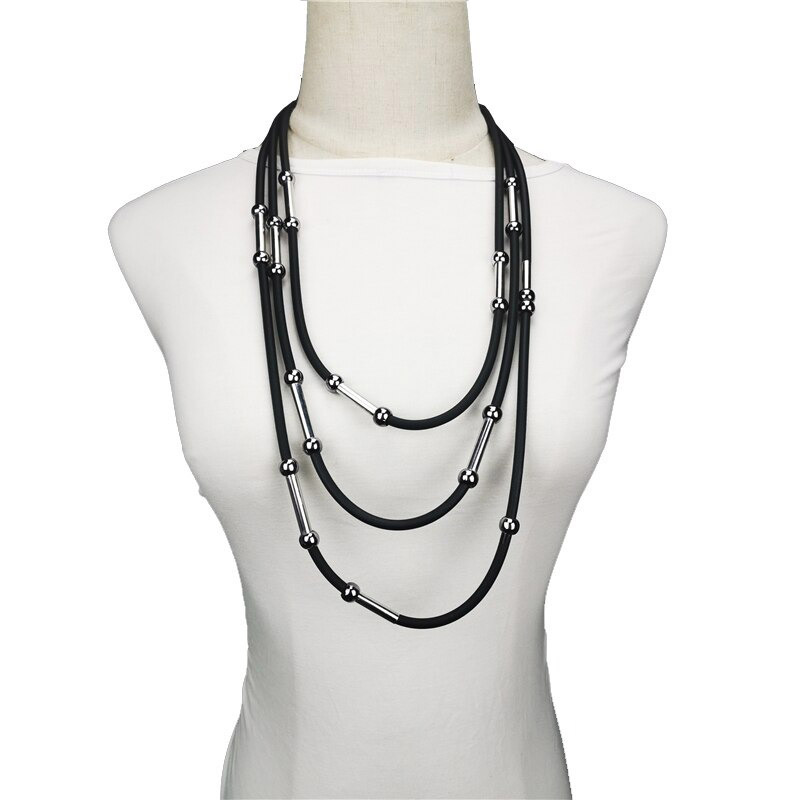 Handmade women's black rubber necklace with stylish silver beads, perfect for casual Bohemian outfits.