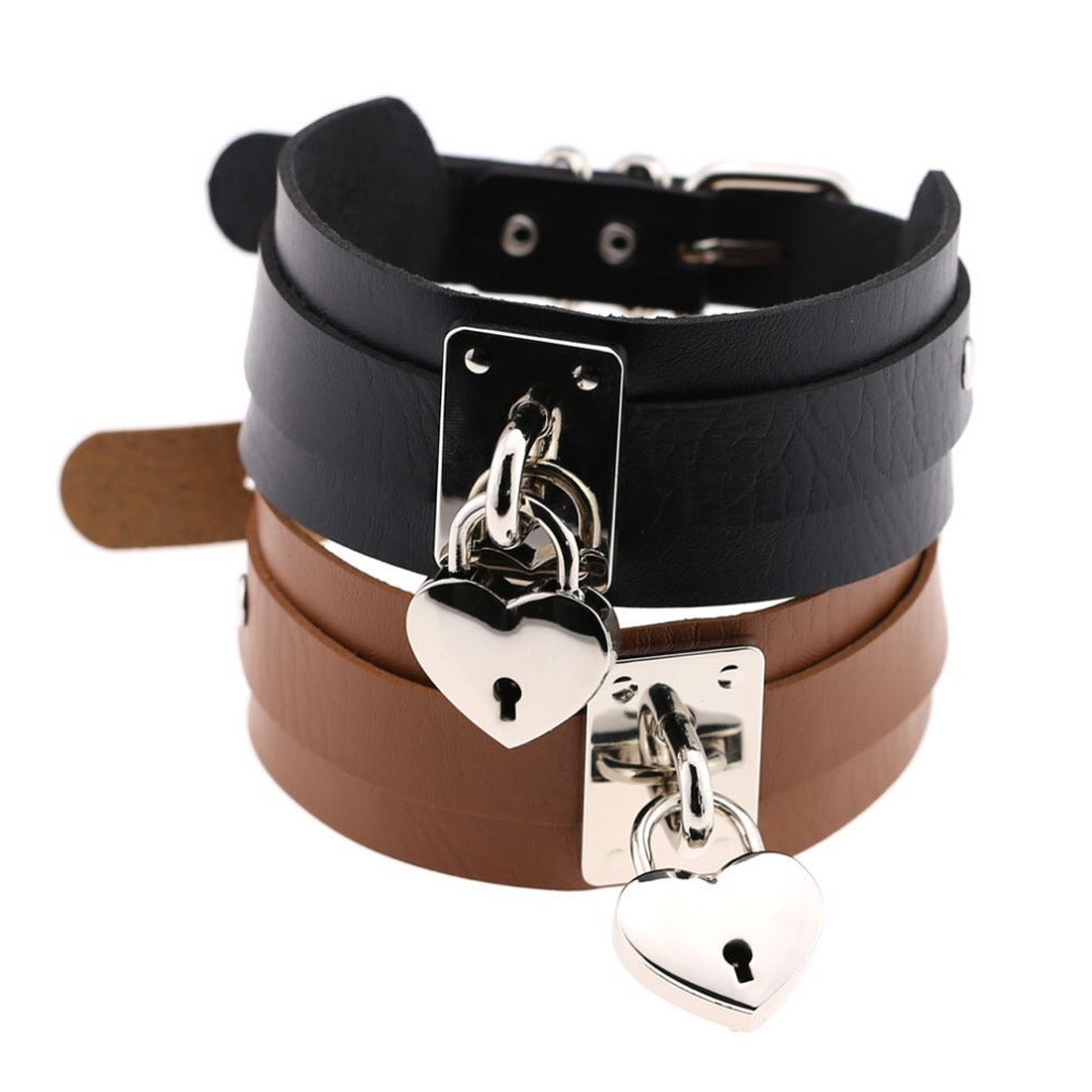 Stacked heart lock choker necklaces in black and brown leather, showcasing a gothic rock style.