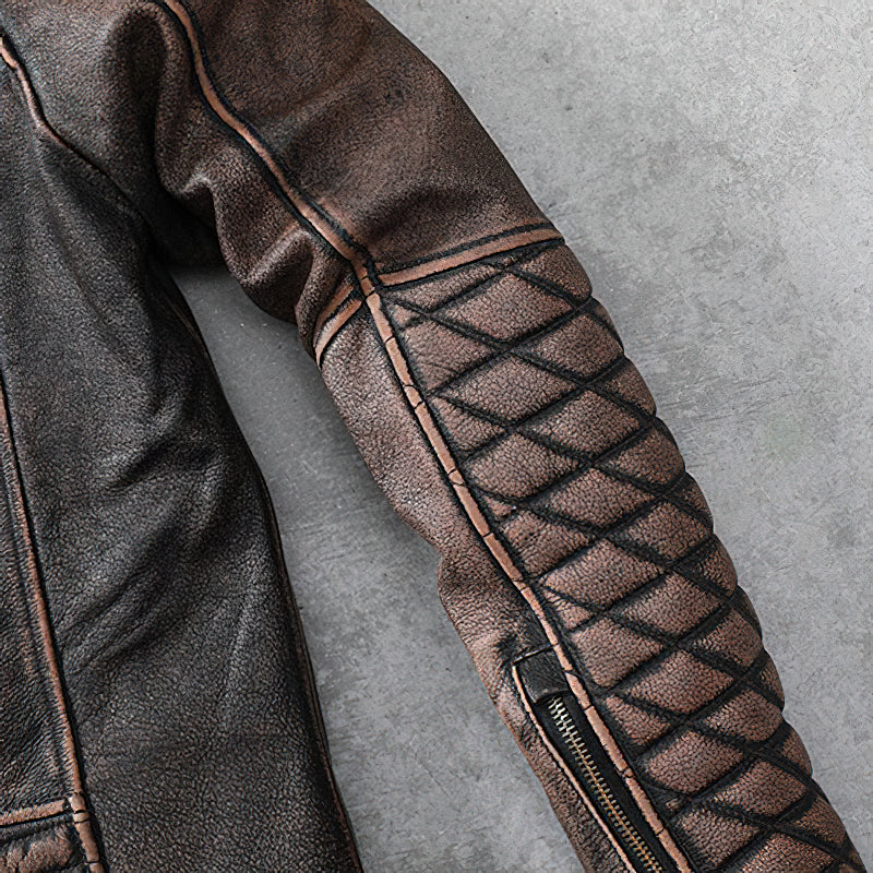 Close-up of heavy genuine leather motorcycle jacket featuring vintage brown color and quilted sleeve design.