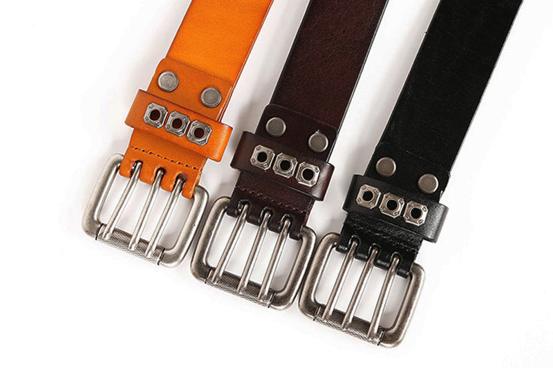 Heavy metal cowboy belts in orange, brown, and black with rivets and stylish buckles for men and women accessories.