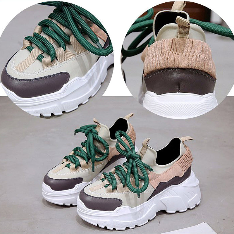 Stylish height-increasing women's running shoes with green laces and a high platform design for ultimate comfort.