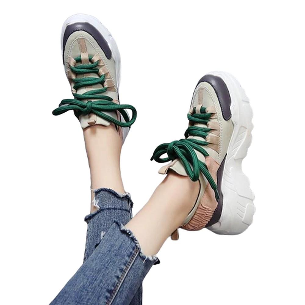 Stylish women's height increasing 6 CM running shoes with green laces, ideal for sports and casual wear.