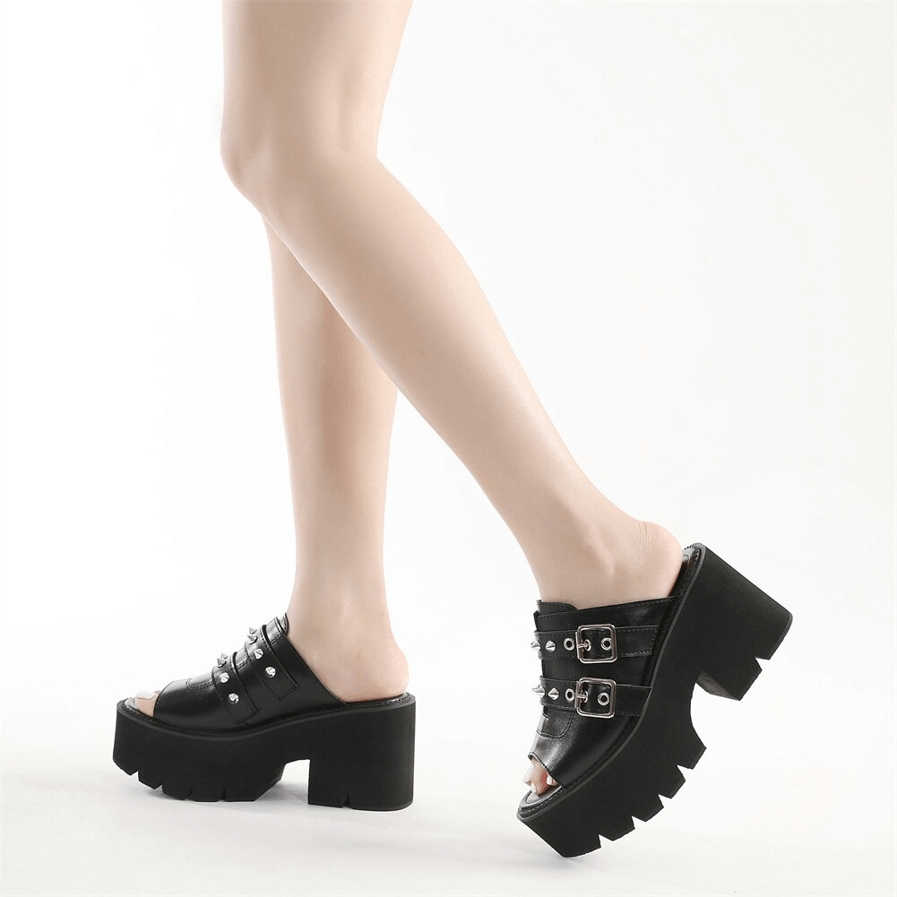 Trendy women's black platform sandals with buckles and spikes, showcasing comfortable open toes and chic casual style.