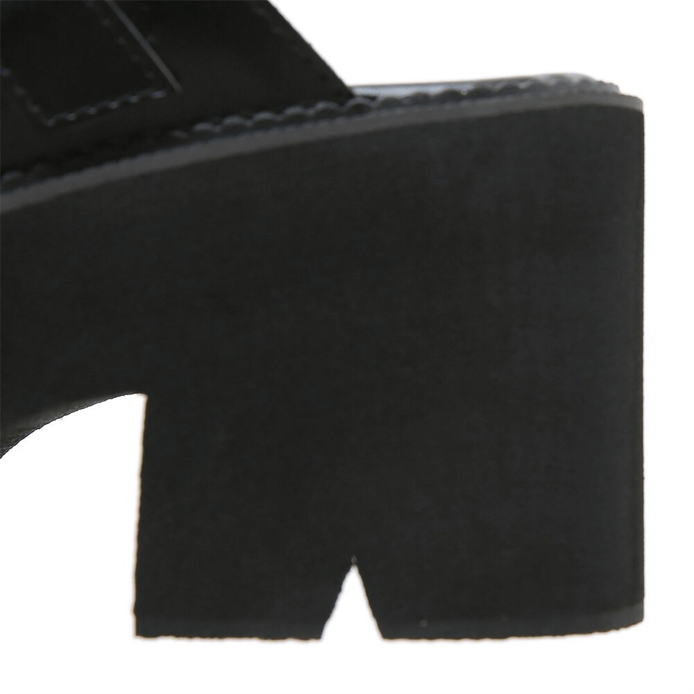 Close-up of a black chunky platform sandal heel showcasing its modern design and rich texture.