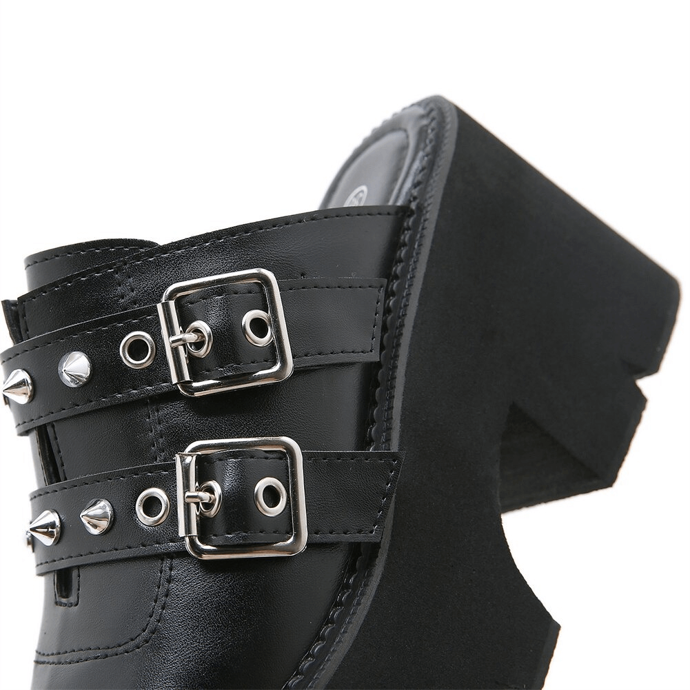 Close-up of women's black PU leather platform sandals featuring stylish buckles and edgy spikes.