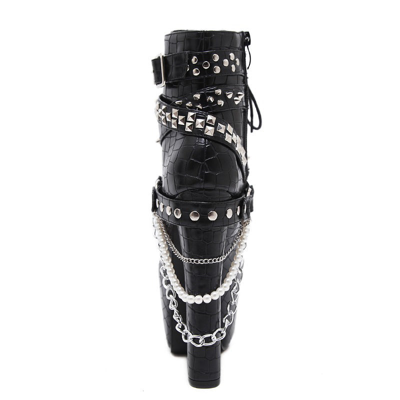 Gothic women's ankle boots with high heels, chains, and studs in black imitation leather.