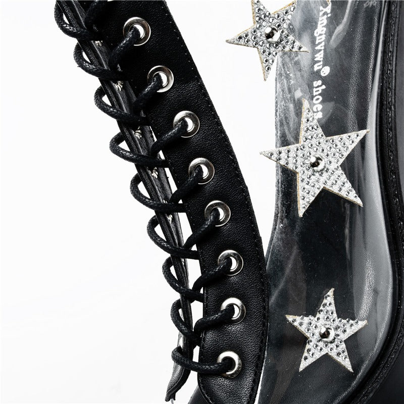 Close-up of punk style high heels with lace-up design, PVC panels, and sparkling crystal stars.