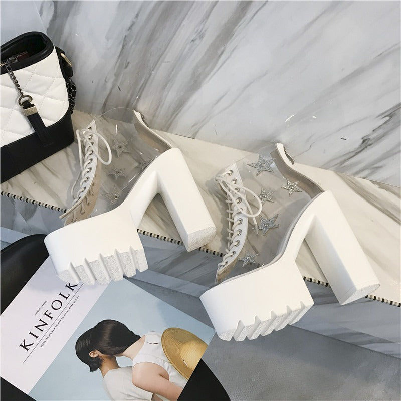 High heels women sandals boots with PVC panels and star crystals, featuring punk style lace-up design and chunky white platform.
