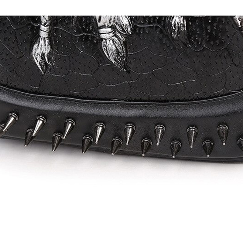 Close-up of 3D leather backpack featuring edgy spikes, textured black material, and gothic design elements.