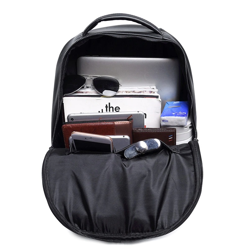 Interior view of a 3D leather unisex backpack filled with gadgets and accessories, showcasing trendy and functional design.