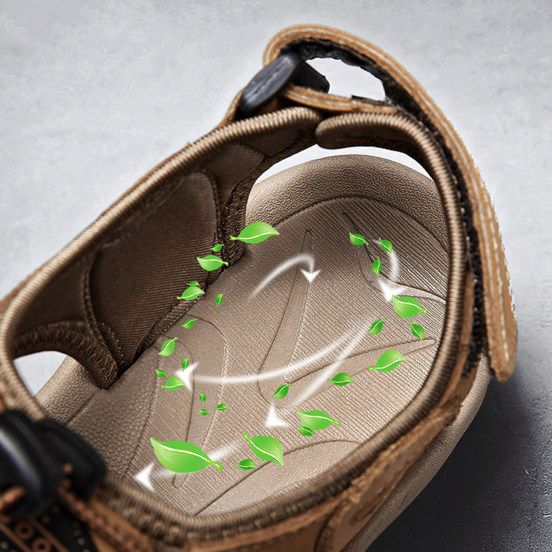 Breathable leather sandal interior with airflow indicators for comfort and freshness during summer wear.