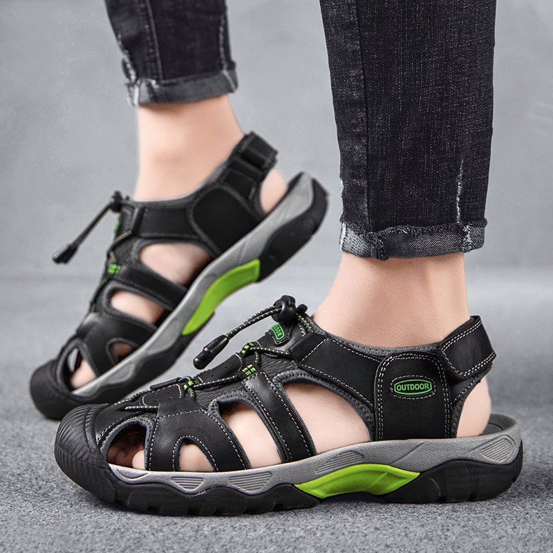 Breathable split leather summer sandals for men featuring a soft outsole and adjustable straps in black with green accents.