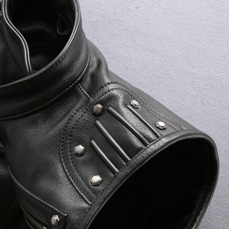Close-up of a men's black leather motorcycle biker vest highlighting zipper and studded details.