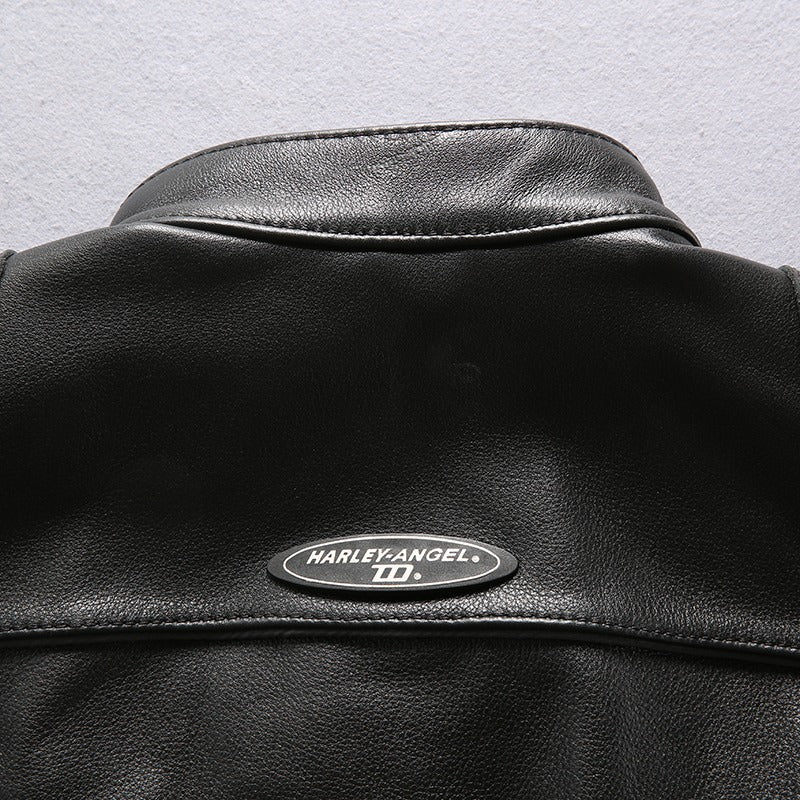 Close-up of the back collar of a black leather motorcycle vest with Harley-Angel branding.