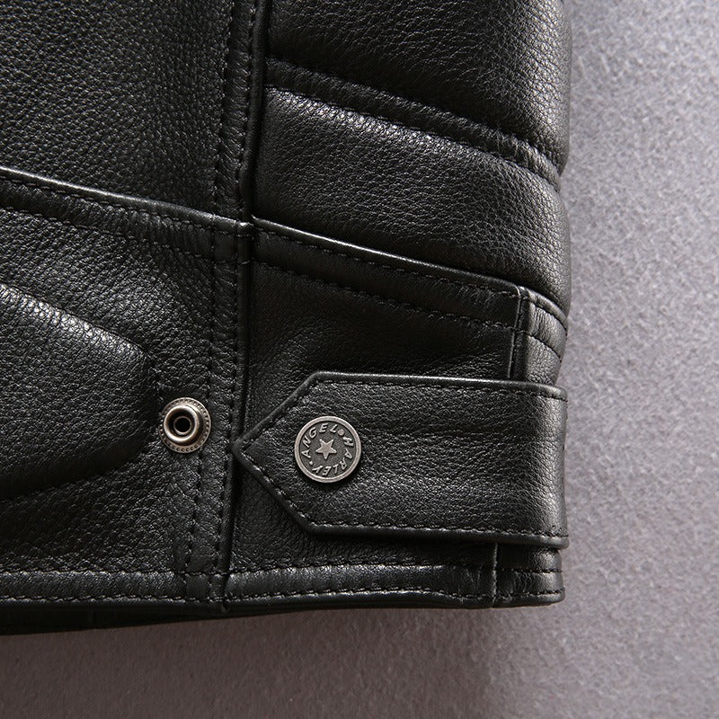 Close-up of a black genuine leather motorcycle biker vest featuring stylish stitching and metal accents.