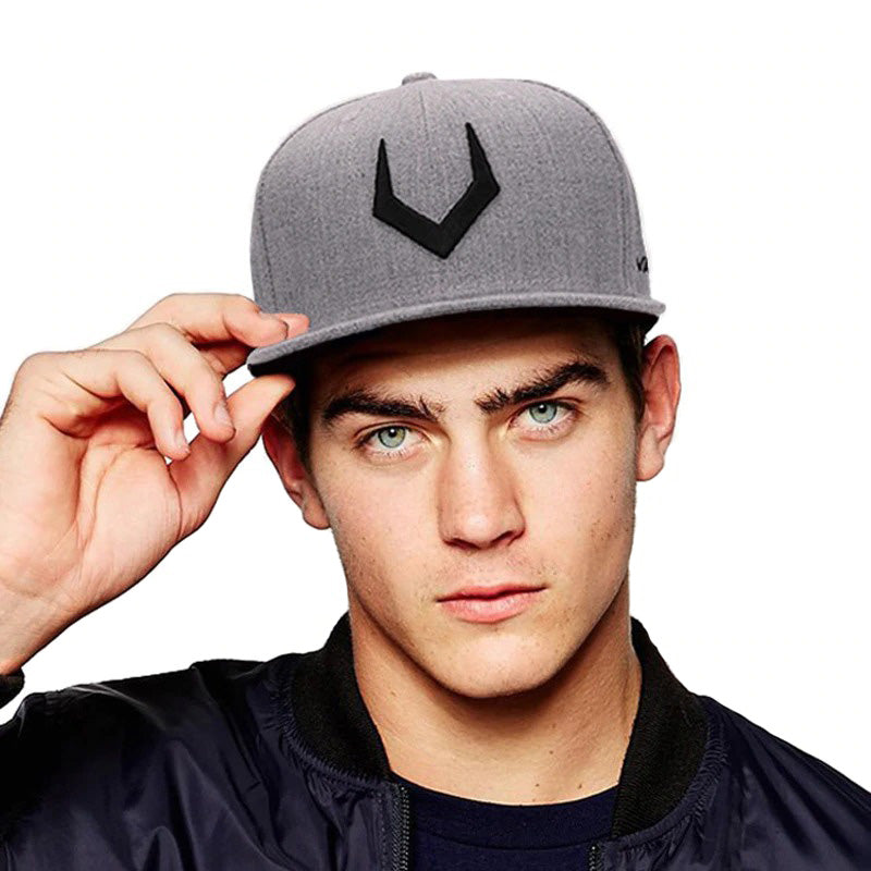 Stylish young man wearing a grey wool baseball cap with 3D embroidery, perfect for both men and women.
