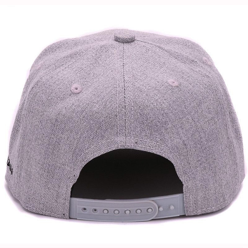 Back view of a grey wool baseball cap featuring a snapback closure for a comfortable fit.