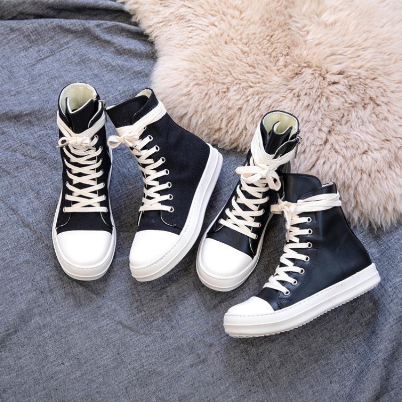 High top retro platform sneakers for rock lovers in black and white, perfect unisex footwear for any style.