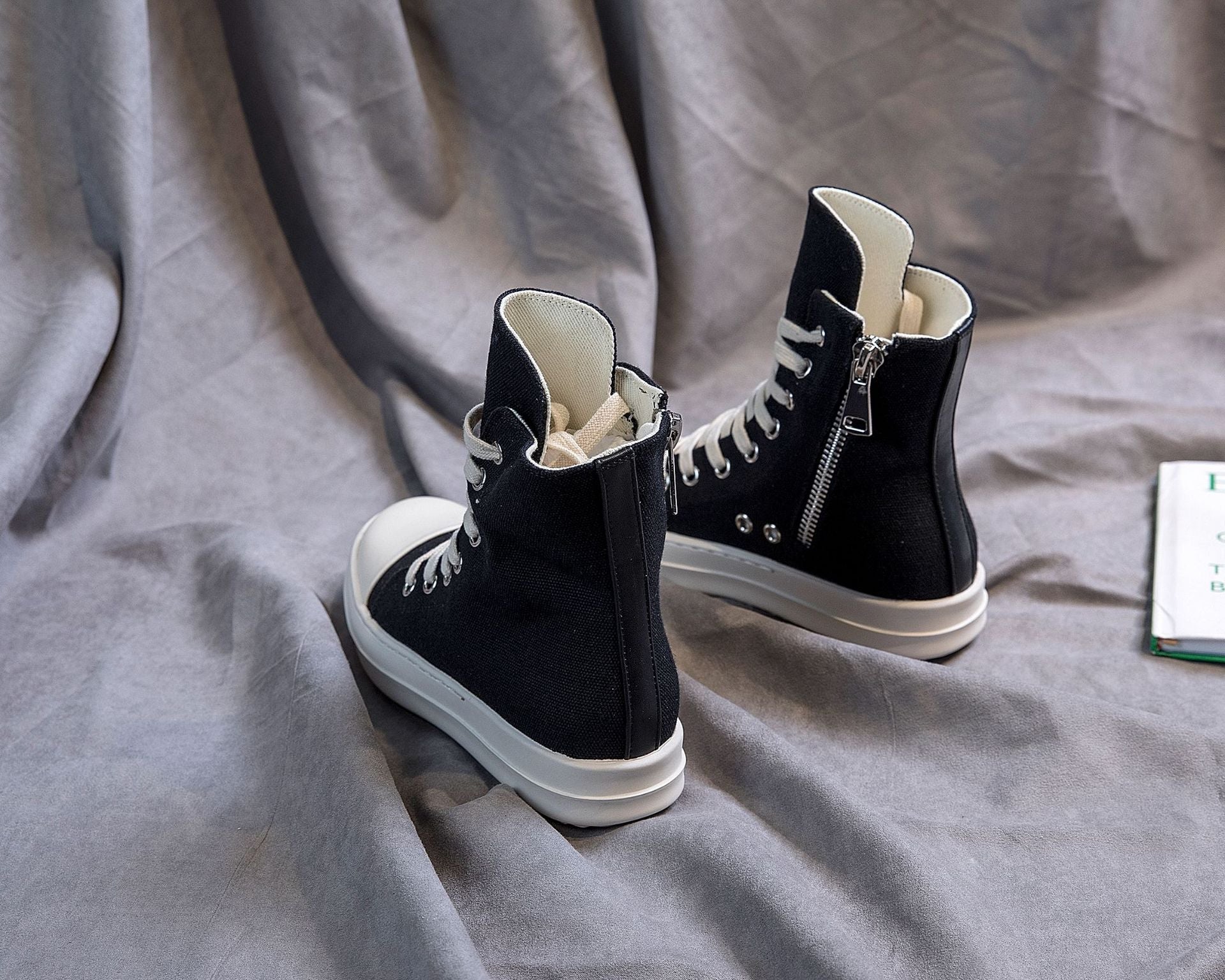 Stylish black retro high top platform sneakers on a gray background, perfect for rock lovers and alternative fashion.