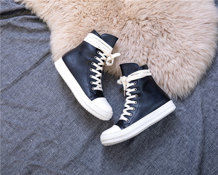 Stylish black high top platform sneakers with white laces, perfect for retro rock lovers and alternative fashion enthusiasts.