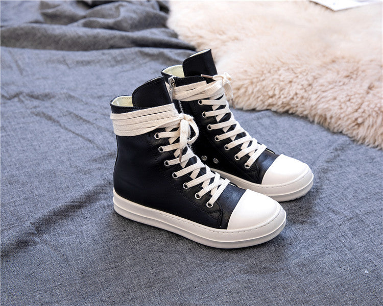 High top retro platform sneakers in black and white, perfect for rock lovers and alternative fashion enthusiasts.